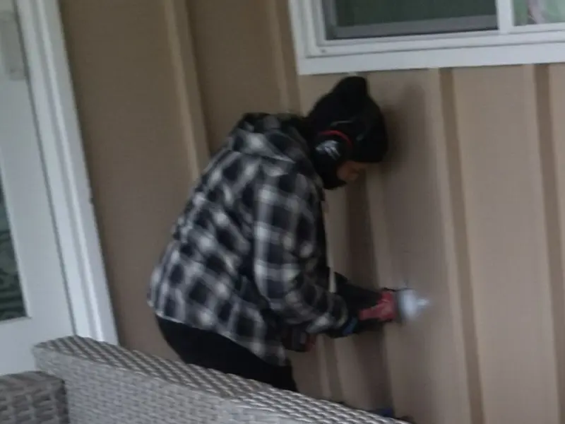 Professional electrician installing an exterior outlet in Elkridge