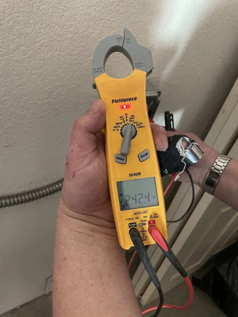 Voltage testing with clamp meter during Electrical Installation Services in Elkridge
